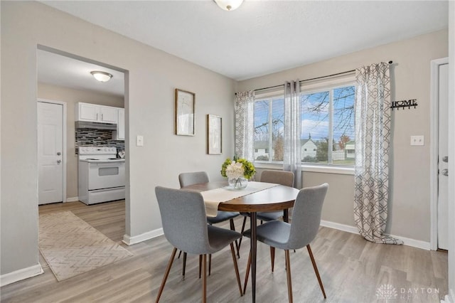 dining space featuring light hardwood / wood-style floors