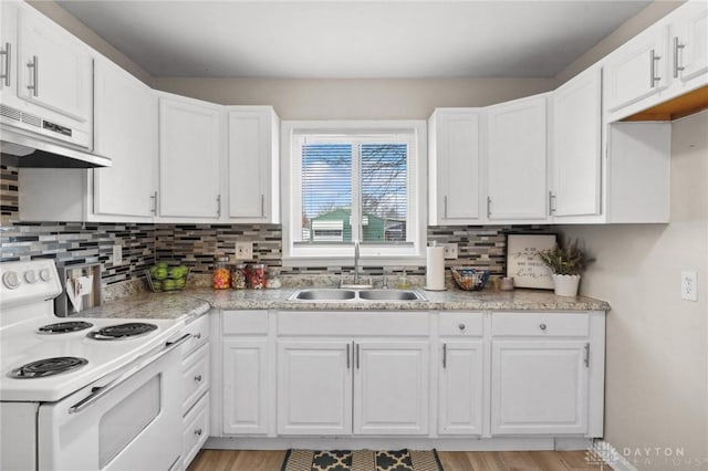 kitchen featuring white electric range, sink, white cabinetry, tasteful backsplash, and light wood-type flooring