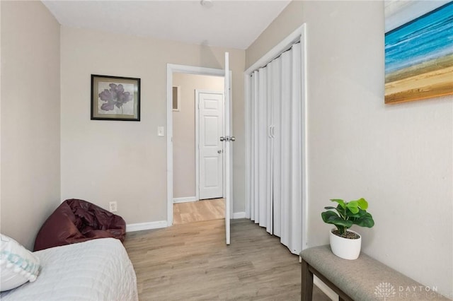 sitting room with light hardwood / wood-style flooring