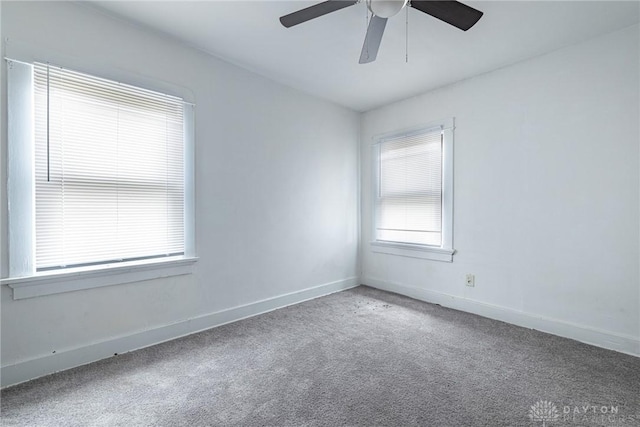 unfurnished room featuring carpet and ceiling fan