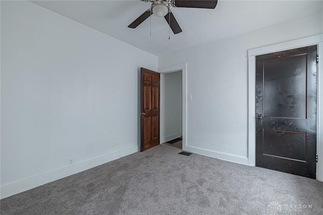 unfurnished bedroom with ceiling fan and carpet flooring