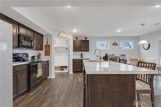 1605 Ashbury Ct, Franklin, OH 45005 - kitchen featuring dark wood-style flooring, light countertops, dark brown cabinets, black appliances, and a sink