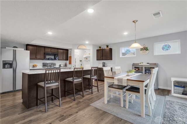 1605 Ashbury Ct, Franklin, OH 45005 - dining room with baseboards, visible vents, wood finished floors, and recessed lighting