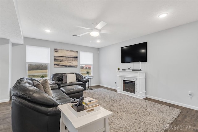 1605 Ashbury Ct, Franklin, OH 45005 - living area featuring recessed lighting, dark wood-type flooring, a glass covered fireplace, ceiling fan, and baseboards