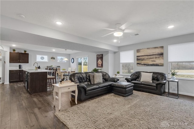 1605 Ashbury Ct, Franklin, OH 45005 - living room with baseboards, dark wood finished floors, visible vents, and a ceiling fan