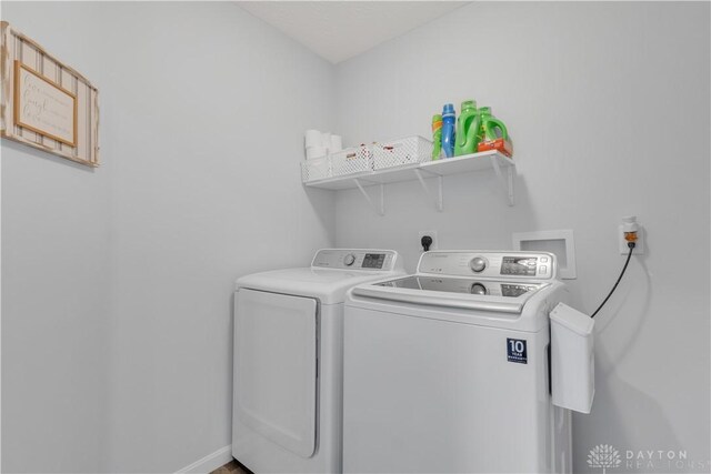 1605 Ashbury Ct, Franklin, OH 45005 - laundry room featuring laundry area, baseboards, and washer and dryer