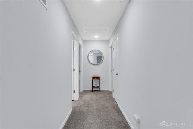 corridor featuring light colored carpet