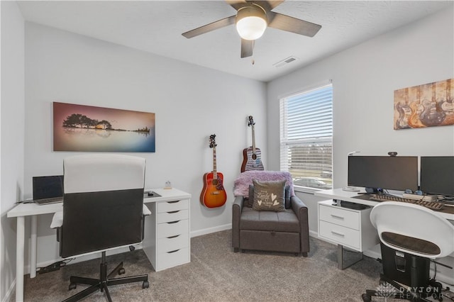 carpeted office featuring ceiling fan