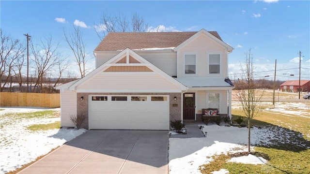 1605 Ashbury Ct, Franklin, OH 45005 - traditional-style house featuring a garage, brick siding, driveway, and fence