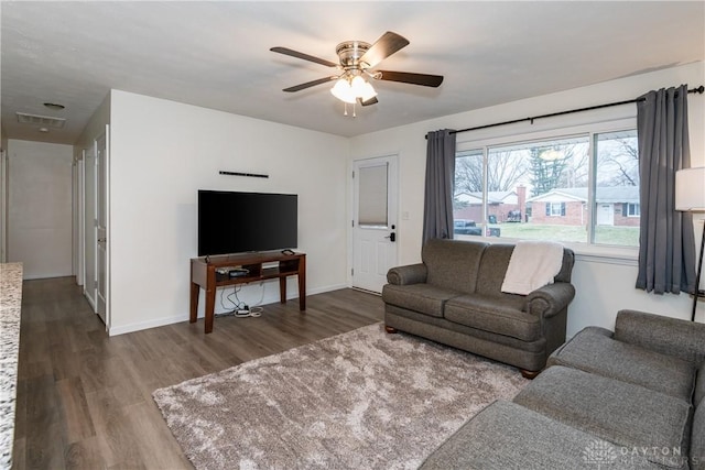 living room with hardwood / wood-style flooring and ceiling fan