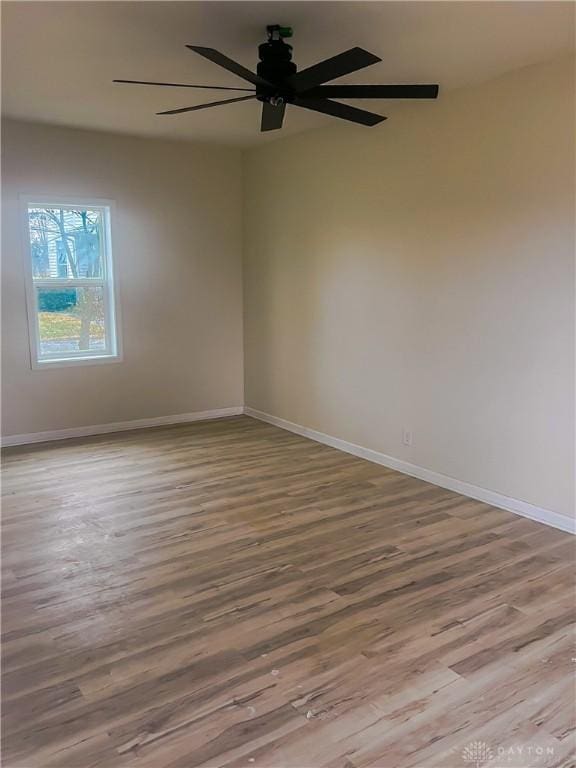 unfurnished room featuring ceiling fan and light wood-type flooring