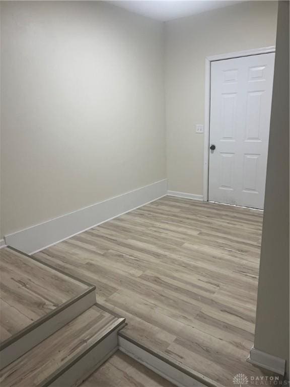 spare room featuring light wood-type flooring