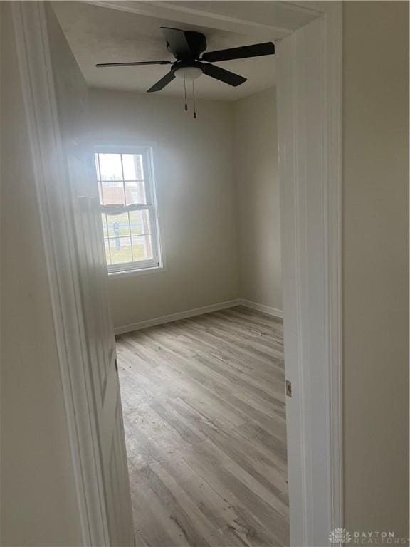 unfurnished room with light hardwood / wood-style floors and ceiling fan