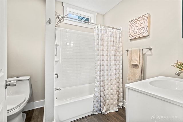 full bathroom featuring toilet, shower / tub combo, baseboards, and wood finished floors