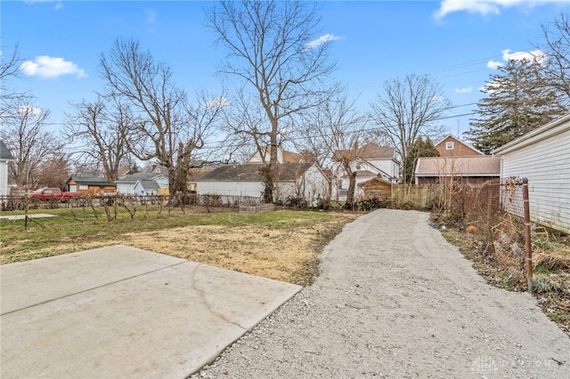 view of yard with fence and a residential view