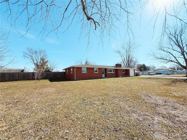 view of side of home featuring a yard