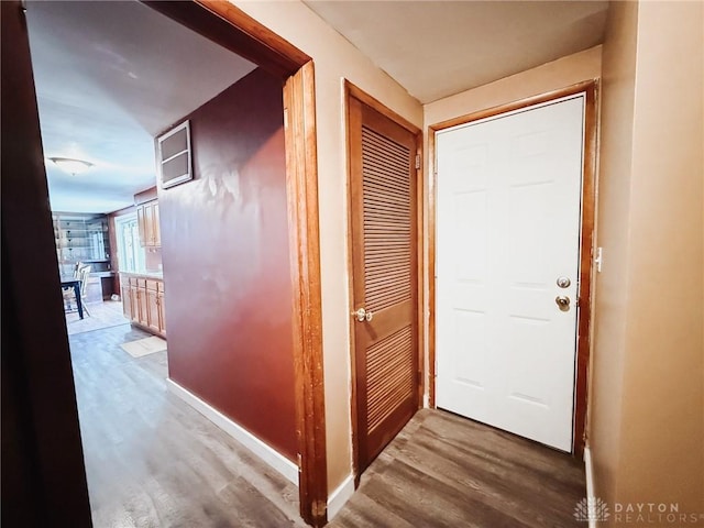 corridor featuring hardwood / wood-style floors