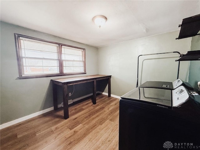 office area featuring washer / clothes dryer and light hardwood / wood-style flooring