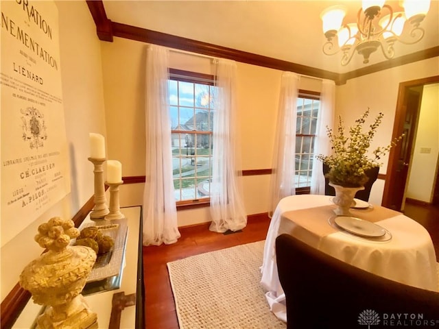 bedroom with dark hardwood / wood-style floors and a notable chandelier