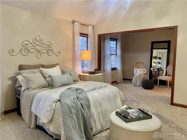 carpeted bedroom featuring vaulted ceiling