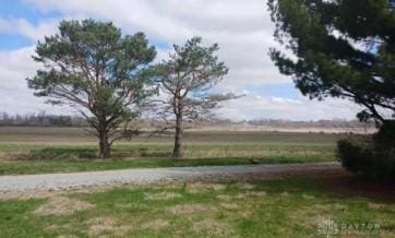 view of yard with a rural view