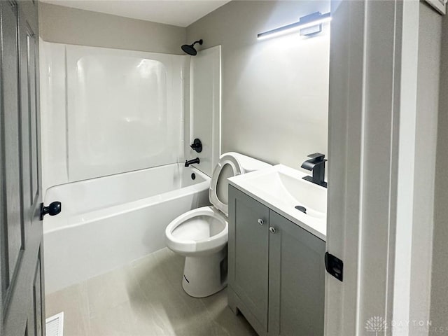 full bathroom featuring vanity, bathing tub / shower combination, and toilet