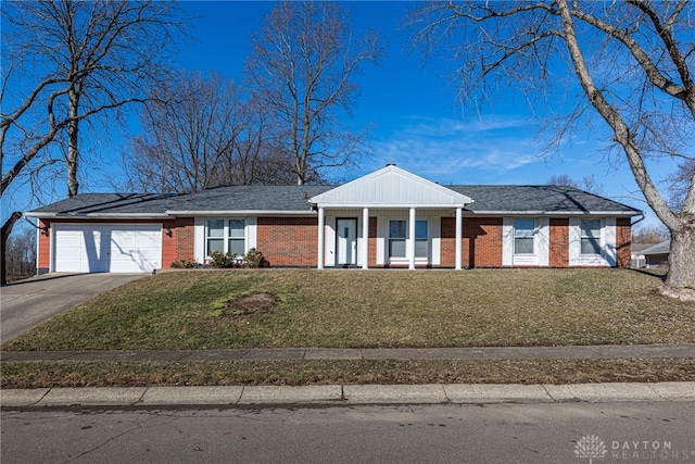 ranch-style home featuring a garage, a porch, and a front lawn