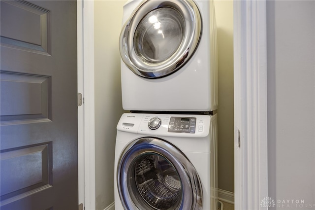 laundry room featuring stacked washer and dryer