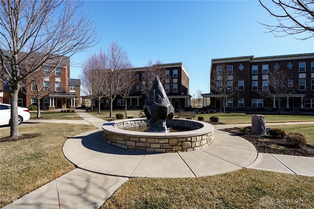 view of property's community with a yard