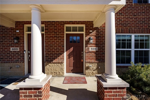 doorway to property featuring covered porch