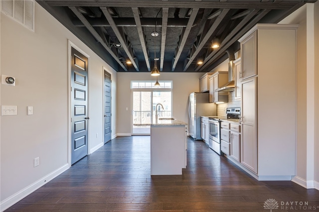 kitchen with sink, appliances with stainless steel finishes, dark hardwood / wood-style floors, an island with sink, and light stone countertops