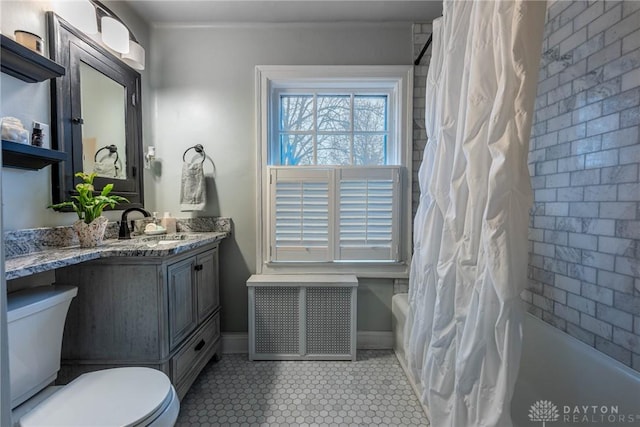 full bathroom featuring vanity, tile patterned floors, shower / bath combination with curtain, and toilet