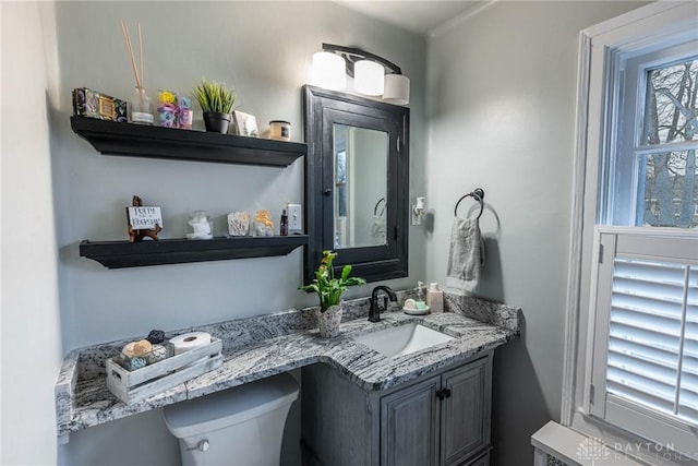 bathroom with vanity and toilet