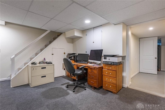 office with a drop ceiling and dark carpet