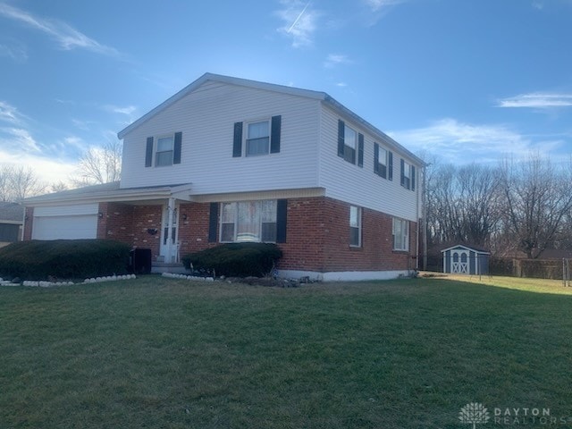 view of front property featuring a garage, a front lawn, and a storage unit