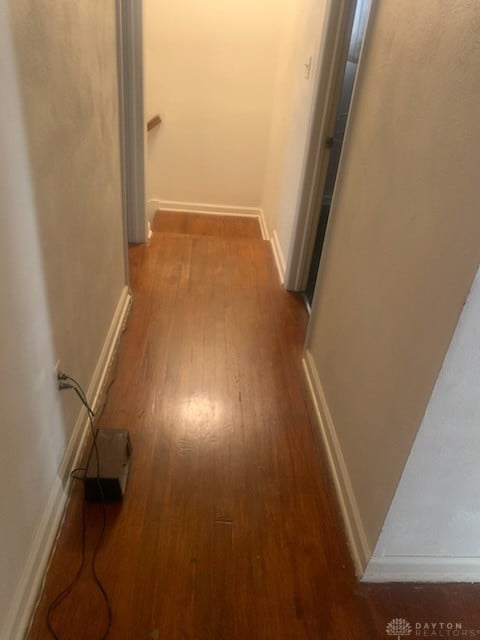 corridor with dark wood-type flooring