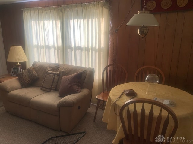 living room featuring wood walls