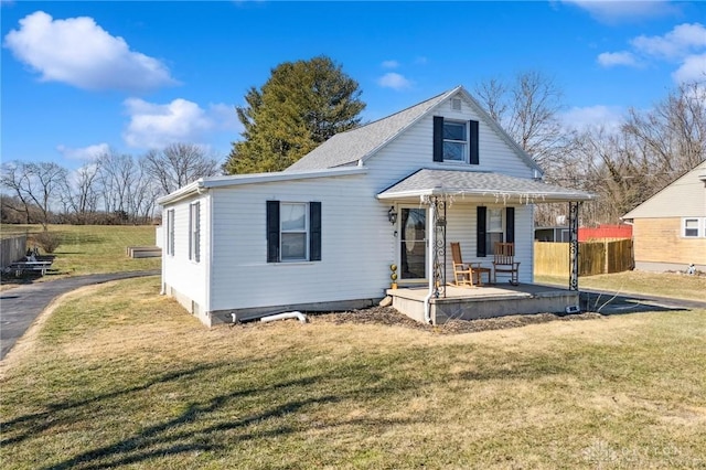 view of front of home with a porch and a front yard