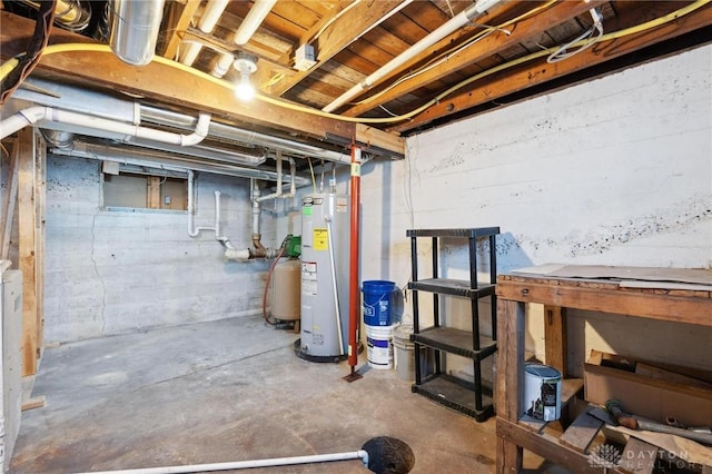 unfinished basement featuring electric water heater