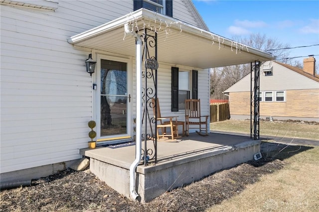 view of exterior entry featuring a porch