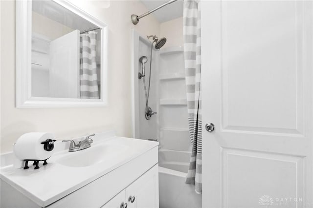 bathroom featuring shower / tub combo and vanity