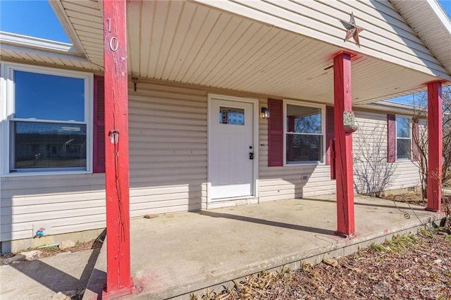 property entrance with covered porch