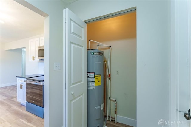 utility room featuring electric water heater