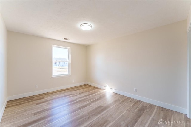 empty room with light hardwood / wood-style floors