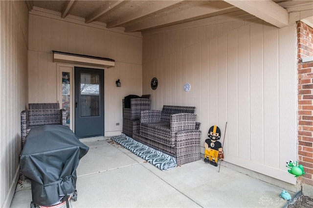 doorway to property with a patio area