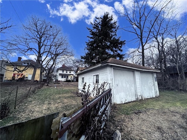 view of side of home featuring an outdoor structure