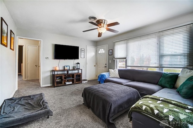 living room featuring carpet flooring, ceiling fan, and baseboards