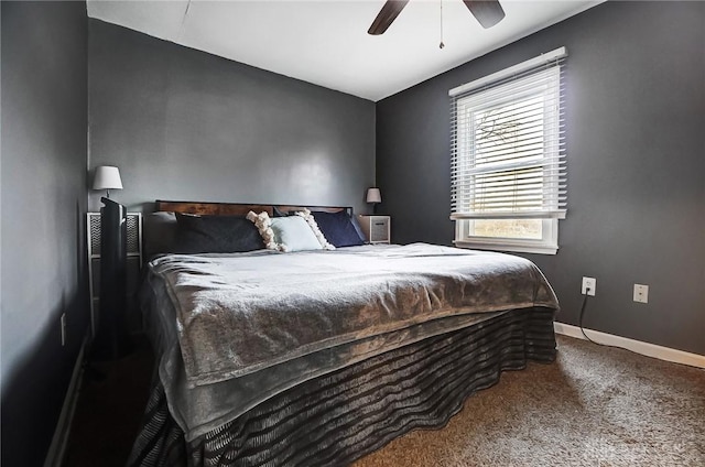 carpeted bedroom featuring a ceiling fan and baseboards