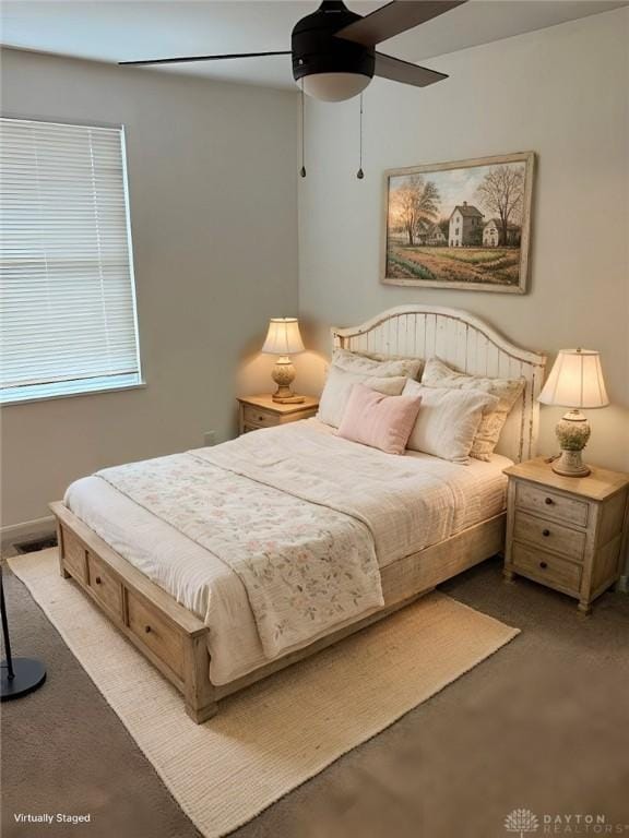 carpeted bedroom with ceiling fan