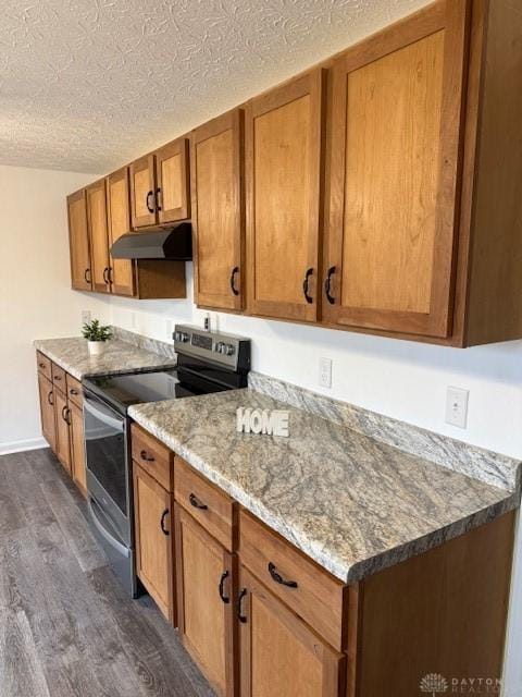 kitchen featuring stainless steel range with electric stovetop, dark hardwood / wood-style floors, a textured ceiling, and stone countertops